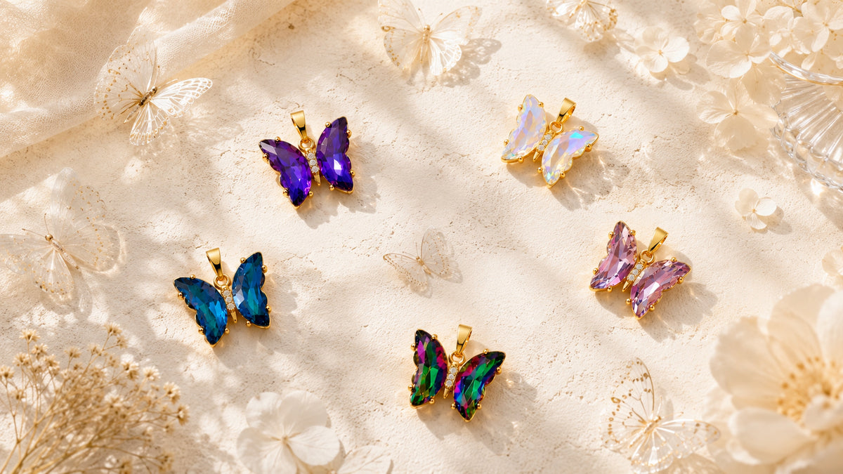 Butterfly pendant collection featuring Twilight Violet among coloured butterfly designs.