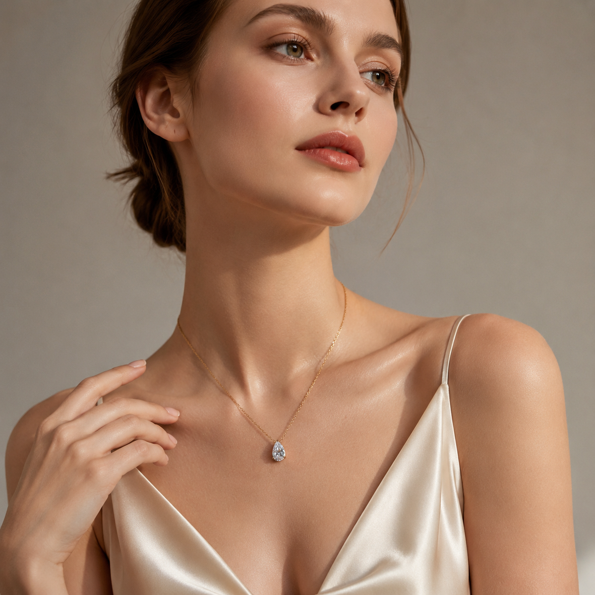 UDROZE April Crystal Clear teardrop birthstone necklace - model wearing the necklace